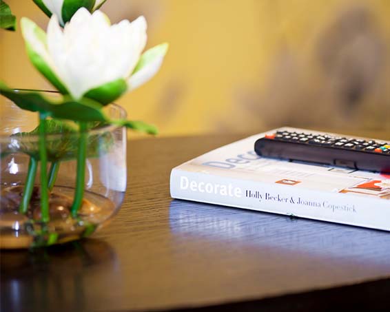 A book on a bedside table