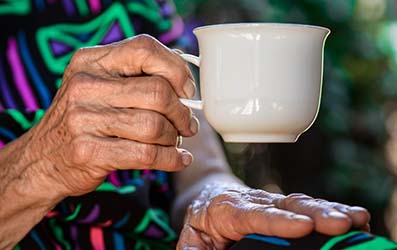 A resident enjoys a cup of tea
