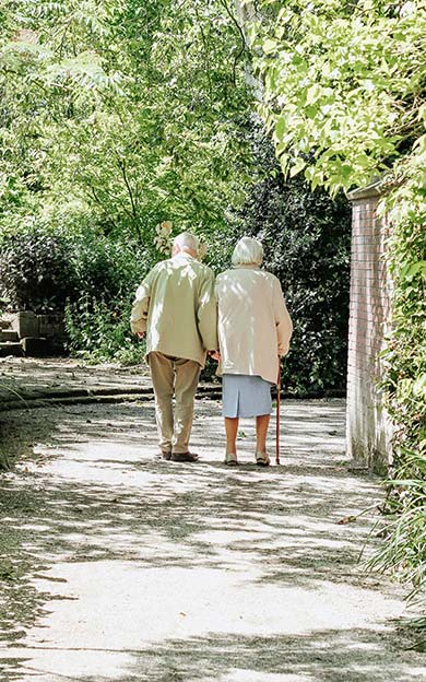 An elderly couple exploring the home grounds
