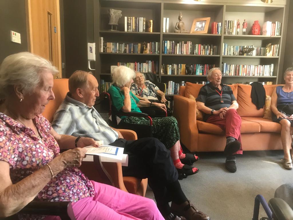 Hazelwell residents spending time reading in the library
