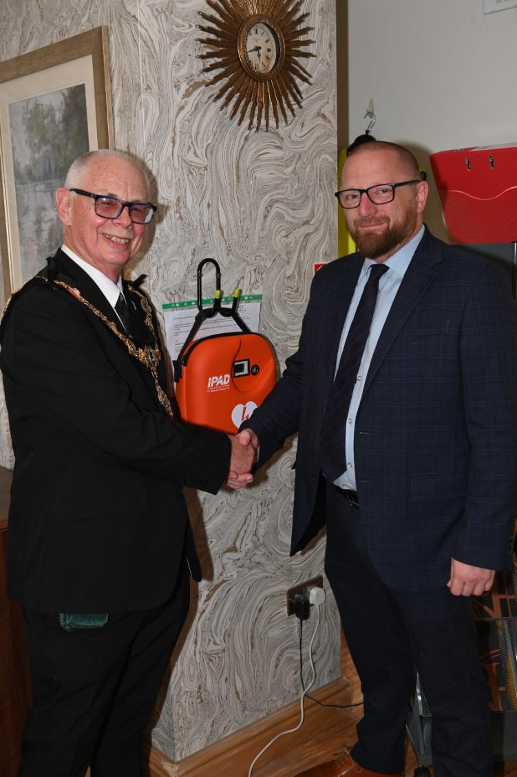 Home Manager and Mayor with newly installed defibrilator installed at the Hazelwell