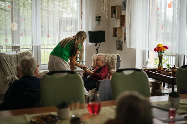 resident and carer in the lounge