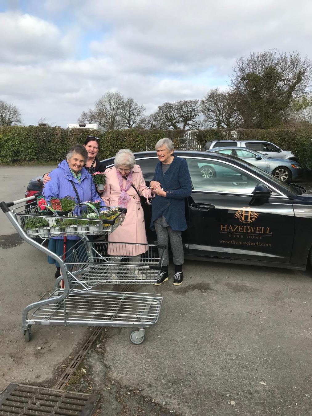 residents with their garden centre purchase