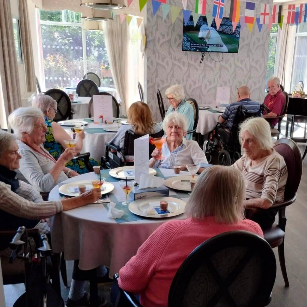 older ladies sat at a table