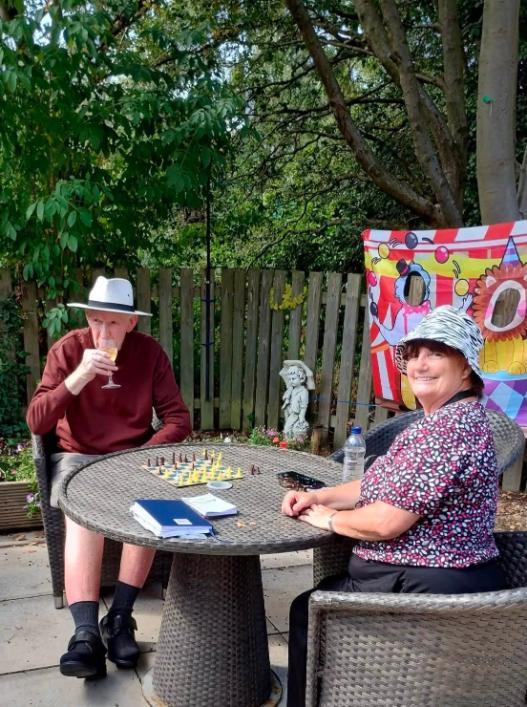 older adults sat in the garden